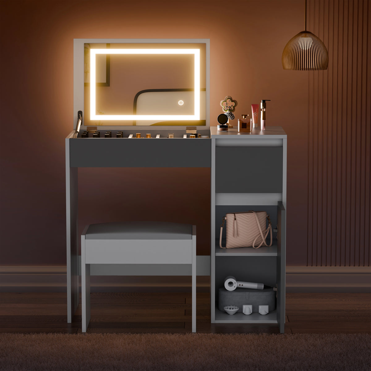 [Grey] Dressing table with illuminated mirror and various items on a warm-toned wall.