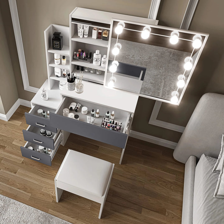 [White + Grey]  Elevated view of dressing table with mirror and lights showing organised beauty essentials in open drawers and shelves