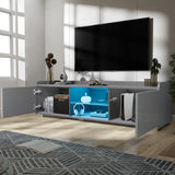 [Grey] grey TV unit doors-open lifestyle with vase, books on top and yellow glow from inside
