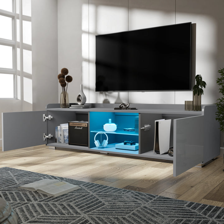 [Grey] grey TV unit doors-open lifestyle with vase, books on top and yellow glow from inside