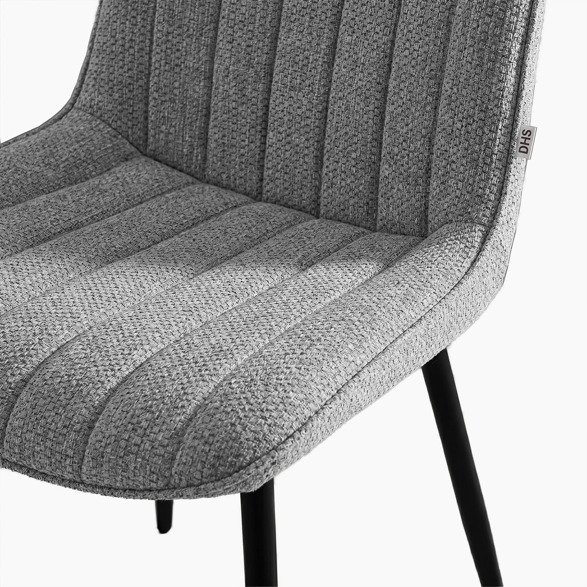 [Grey | Set of 2] Close-up of fabric dining chair seat and back showing textured vertical stitched padding