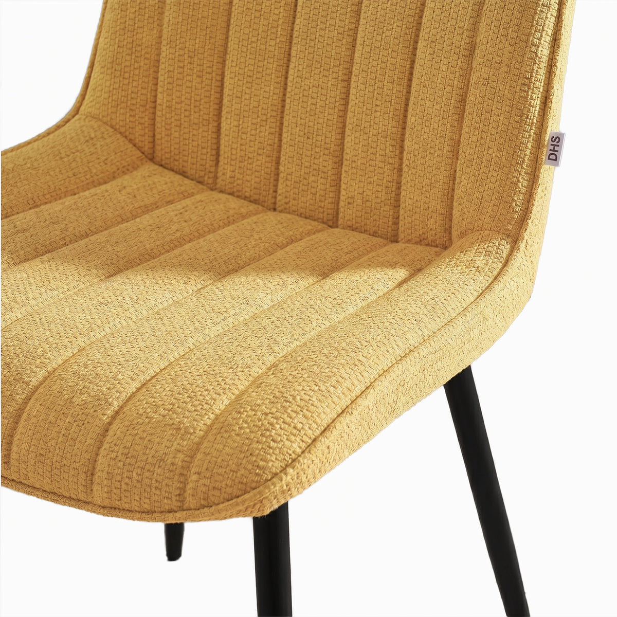[Mustard | Set of 4] Close-up of fabric dining chair seat and back showing textured vertical stitched padding