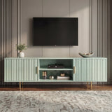 [Sage Green] Angled sage green 180cm TV unit with soundbar on central shelf and TV mounted above on panelled wall.