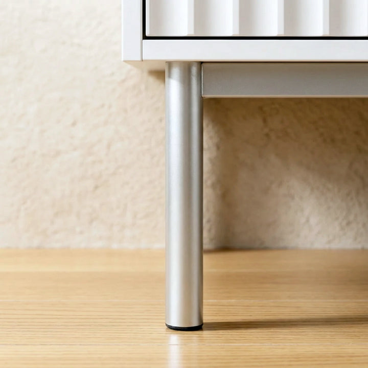 [White] two door wardrobe silver metal leg detail with raised base displaying its unique design and sturdy base