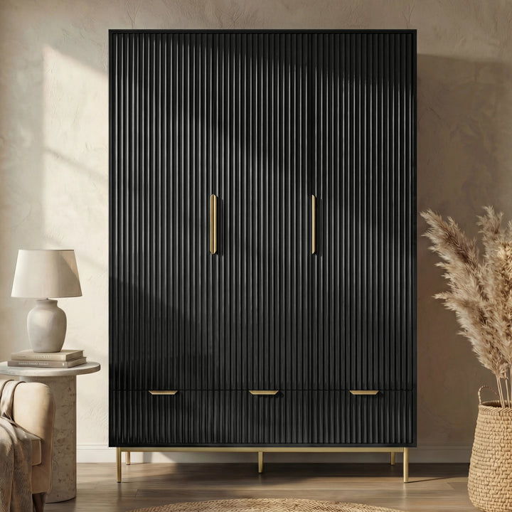 [Black] Flutrina 3 door wardrobe front, 3 black fluted doors with gold vertical handles and 3 drawers on gold legs