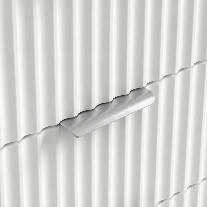 [White] three drawer chest handle detail showing the painted recessed pull bridging two ribbed drawers