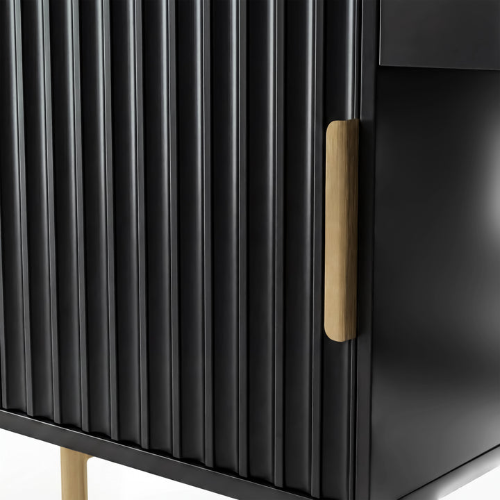 [Black] macro of the ribbed flutrina door panel in black with a gold handle and gold tube leg visible