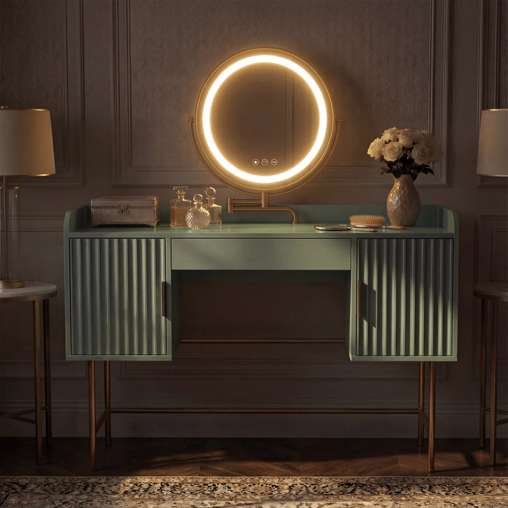 [Sage Green] front view of the sage green fluted dressing desk with amber-toned round mirror against panelled wall