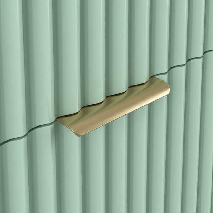 [Sage Green] Close detail of golden metal handle on green flutrina drawer of chest front with vertical lines and stylish pattern