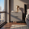 [Grey] Grey flutrina 2 drawer bedside table beside upholstered bed with brass mushroom lamp on top