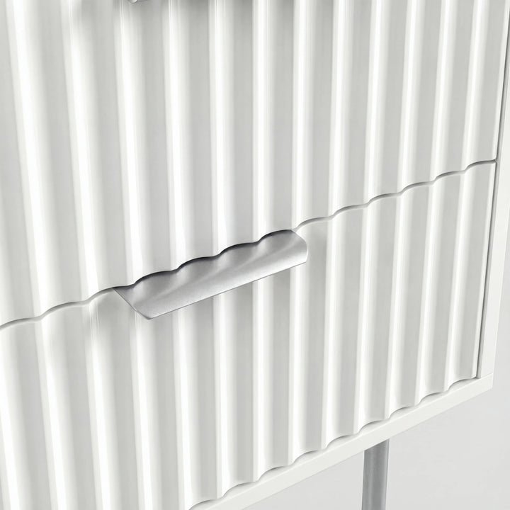[White] Close detail of silver metal drawer handle and legs mounted on white flutrina cabinet front