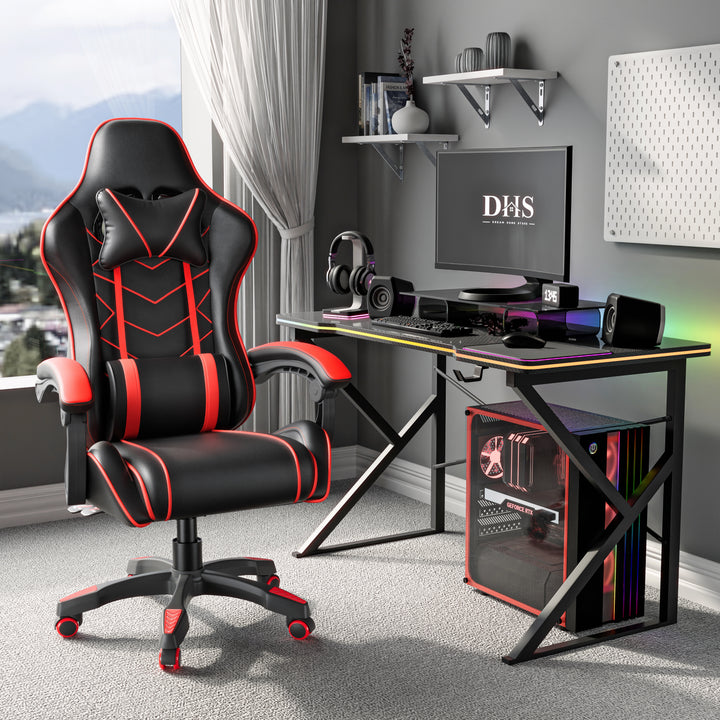 [Black + Red] Ergonomic gaming chair with lumbar support and padded armrest in black and red, placed in a modern gaming setup with DHS branding on the monitor.
