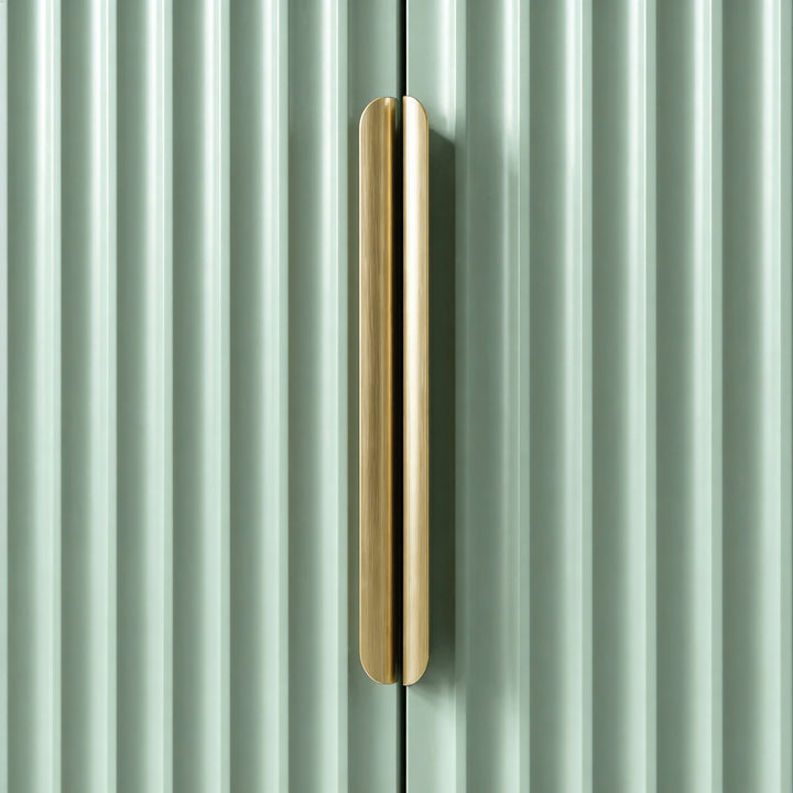 [Sage Green] Close detail of green wardrobe vertical metal handle against painted surface