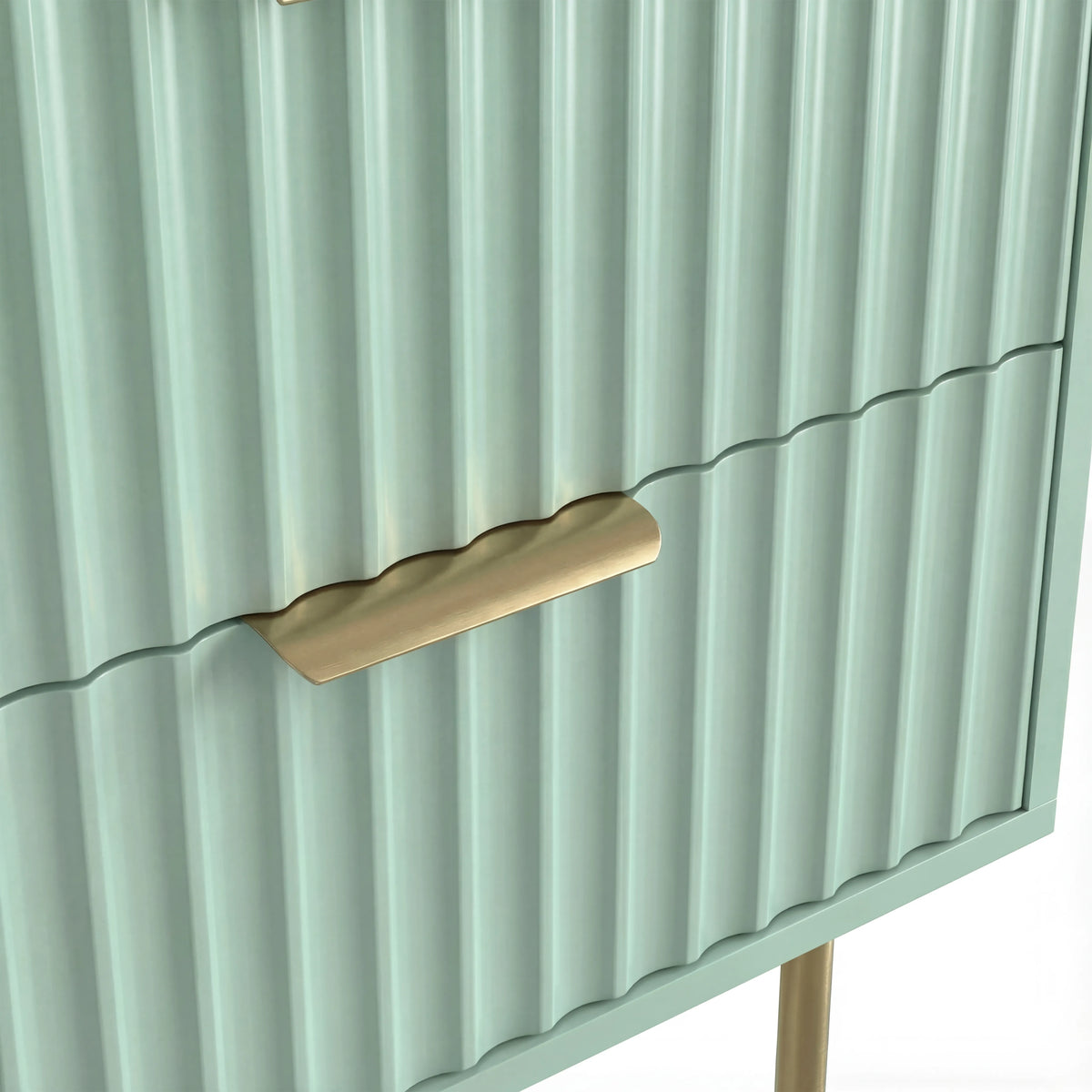 [Sage Green] Close detail of the golden metallic handle fixed to the green flutrina design drawer surface of a nightstand