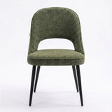 [Green | Set of 4]  Front view of the comfy fabric dining chair with rounded open back, piped seat and four black metal legs.
