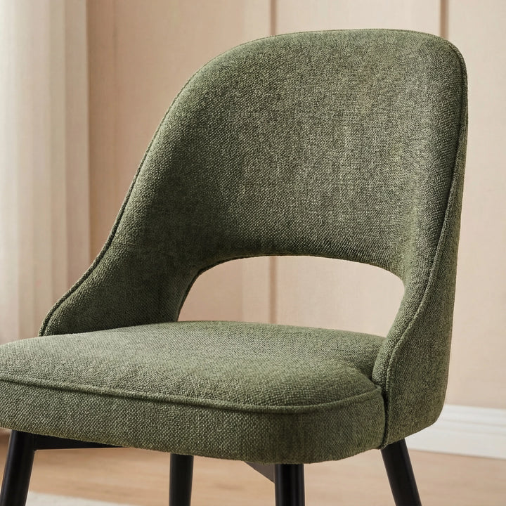 [6 Seater | Green] Detail of Xylon green chair curved backrest with hollow oval gap above the seat