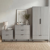 [Grey] Matching furniture set containing a wardrobe, drawers for the bedroom, and a bedside table in a natural light room