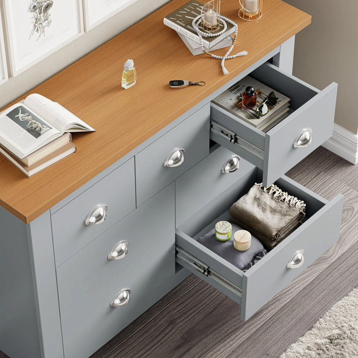 [Grey] 7 drawer chest of drawers with small and large drawers open showing blanket candle and perfume bottle inside