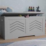 [Grey] Grey storage chest with two chevron-cut front panels, navy star wallpaper behind in child's room