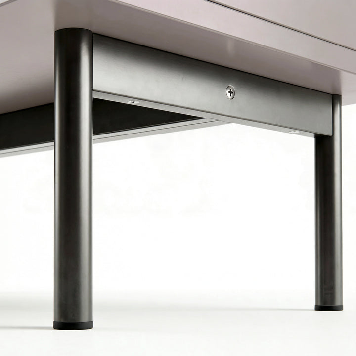 [Grey] 3 drawer chest close-up of black cylindrical support legs and horizontal frame at the base