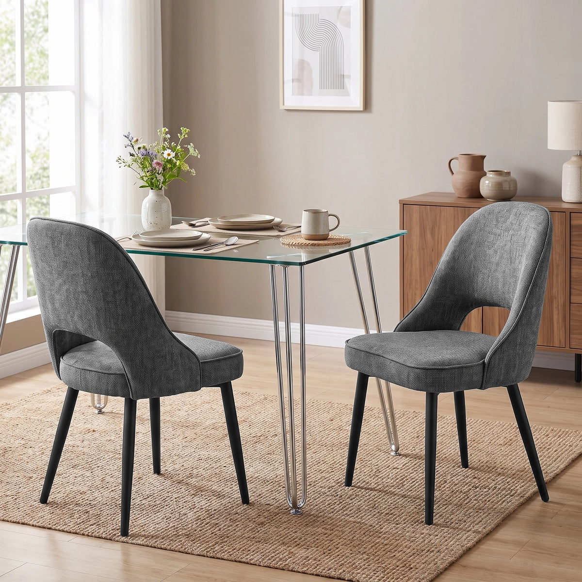 [Grey | Set of 2] Pair of curved-back comfortable dining chairs at a glass table with chrome hairpin legs and black chair legs.