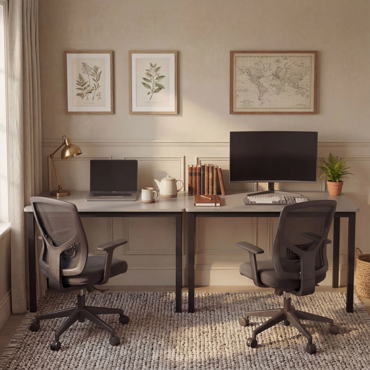 [120 X 50 cm] Computer Desk arranged as dual workstation in a beige room with botanical art, world map, mesh chairs, laptop, and curved monitor