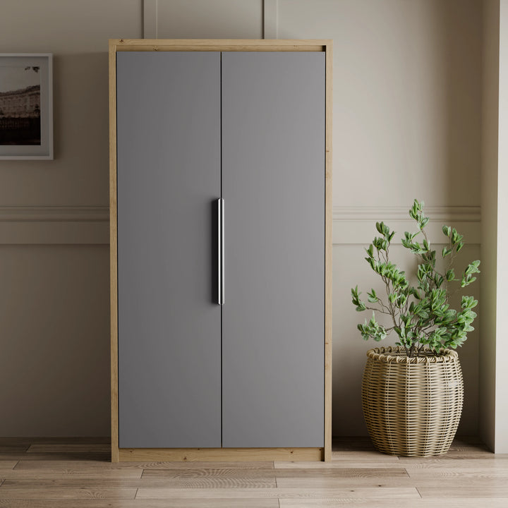 [Oak+Grey] front view of Skova 2 door wardrobe, grey flat doors meeting at vertical chrome handle