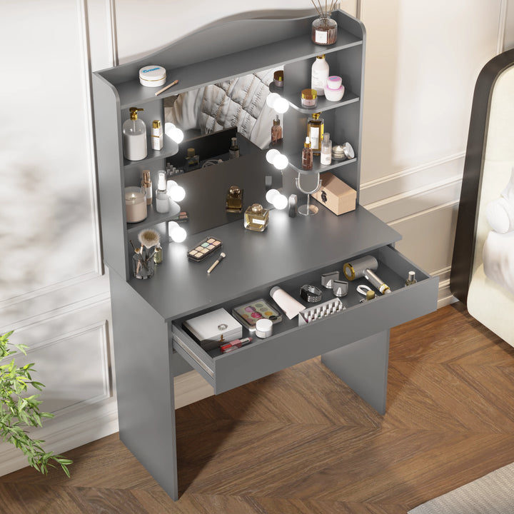 [Grey]  vanity with mirror and lights featuring five open drawer filled with makeup essentials