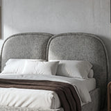 [Double | Grey] Embracea headboard close-up showing two arched upholstered panels in textured boucle fabric
