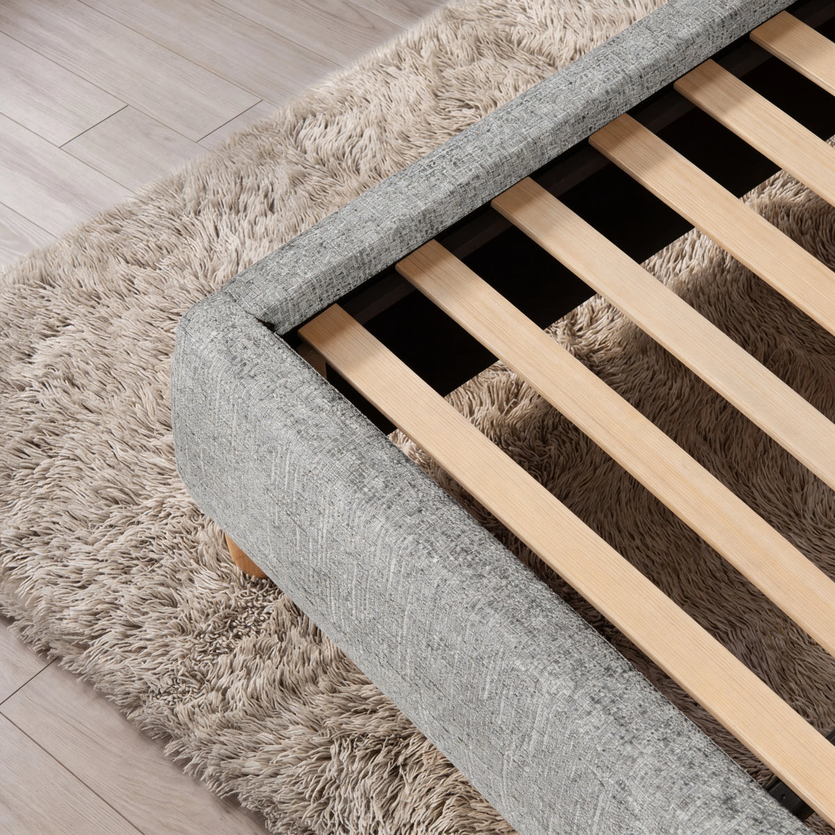 [Double | Grey] Embracea bed frame underside showing solid wooden support slats and upholstered side rails