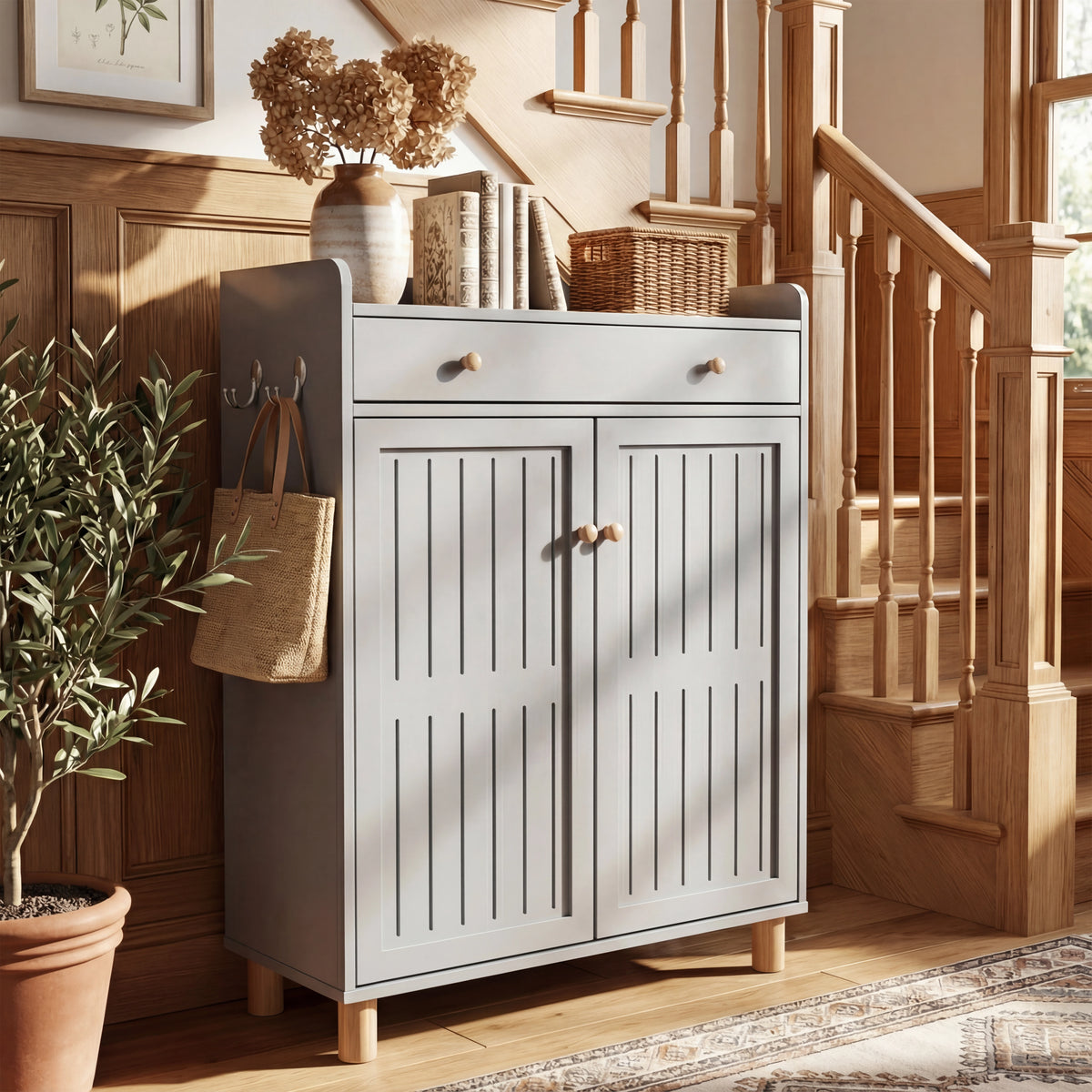 [Grey] Compact grey shoe storage unit with slatted door design placed against a wall with bright light