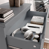 [Grey] Close-up of drawer in grey high gloss chest, displaying storage for headphones, books, and personal items.