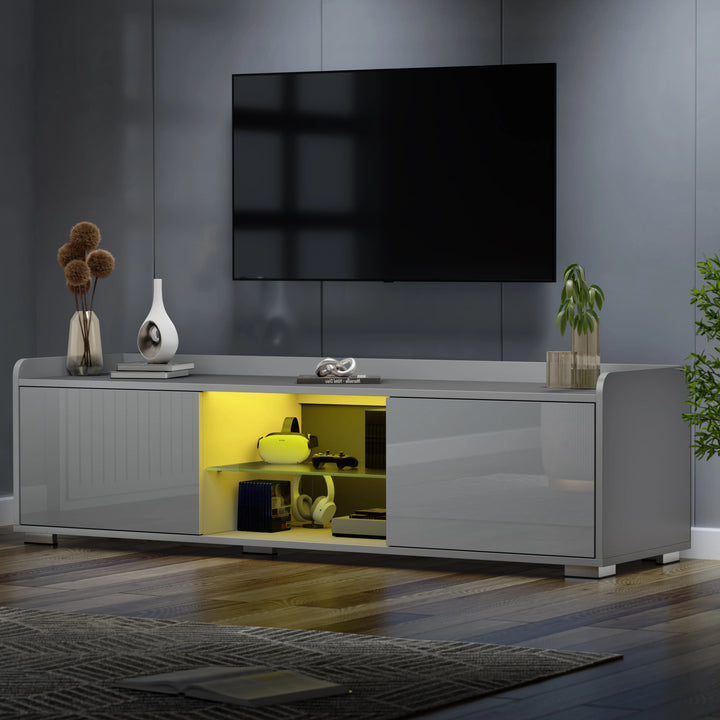 [Grey] grey TV unit angled shot with TV above and herringbone wood floor in light-filled room