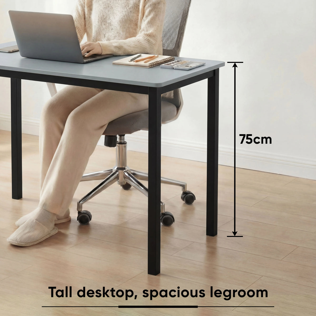 [100 X 50 cm] Office Desk shown with woman working on laptop, highlighting 75cm tall desktop and spacious legroom for comfortable seating
