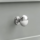 [Grey] Close-up shot of the polished chrome round knob handle on the Oskara Grey Painted TV Unit drawer.