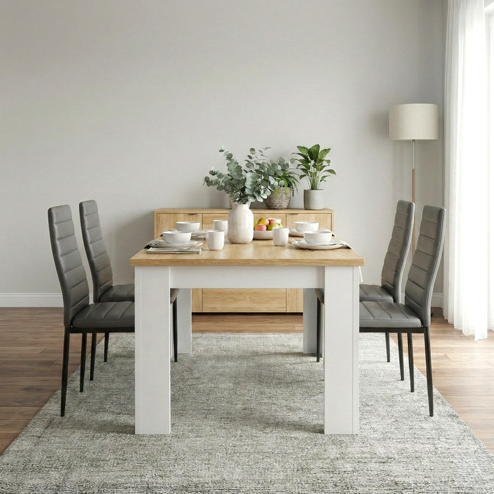 [4 Seater | Grey] Dining Table and Chairs Set with four grey faux leather chairs around a pine-top table in a minimal grey dining room with sideboard