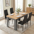 [4 Seater | Black] Grey & Pine 4-6 Seater Dining Table with four black chairs and a white rose centrepiece in a neutral dining room