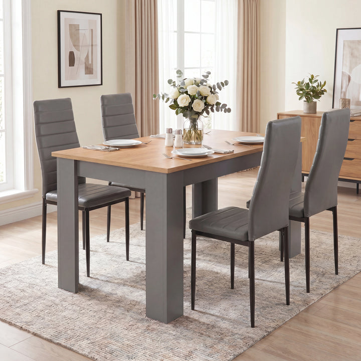 [4 Seater | Grey] Front view of a Grey & Pine 4-6 seater dining table with four grey faux-leather chairs.