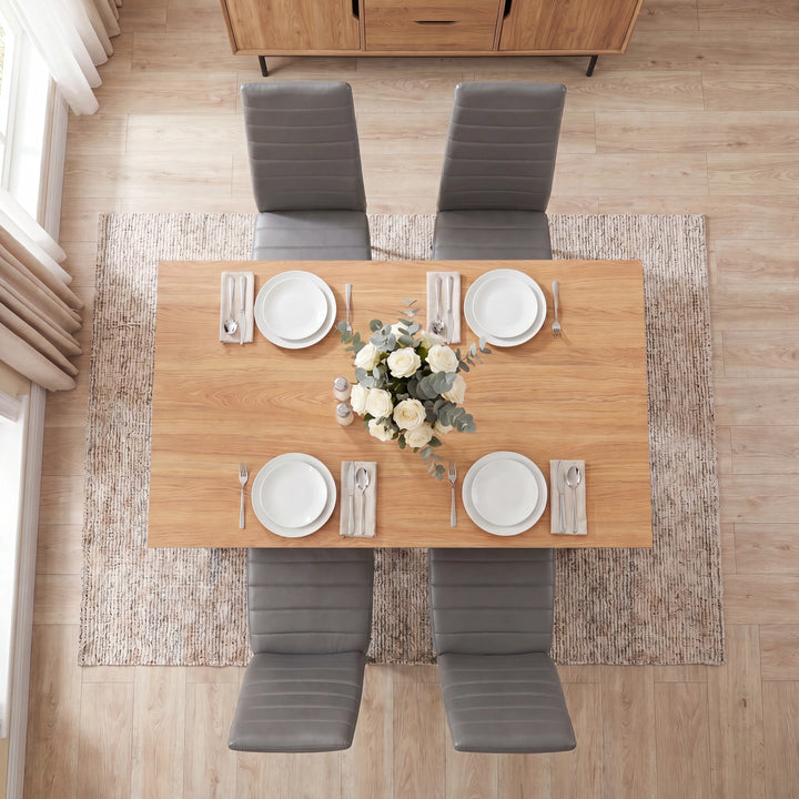 [4 Seater | Grey] Overhead view of a Grey & Pine dining table with four grey chairs and white place settings.