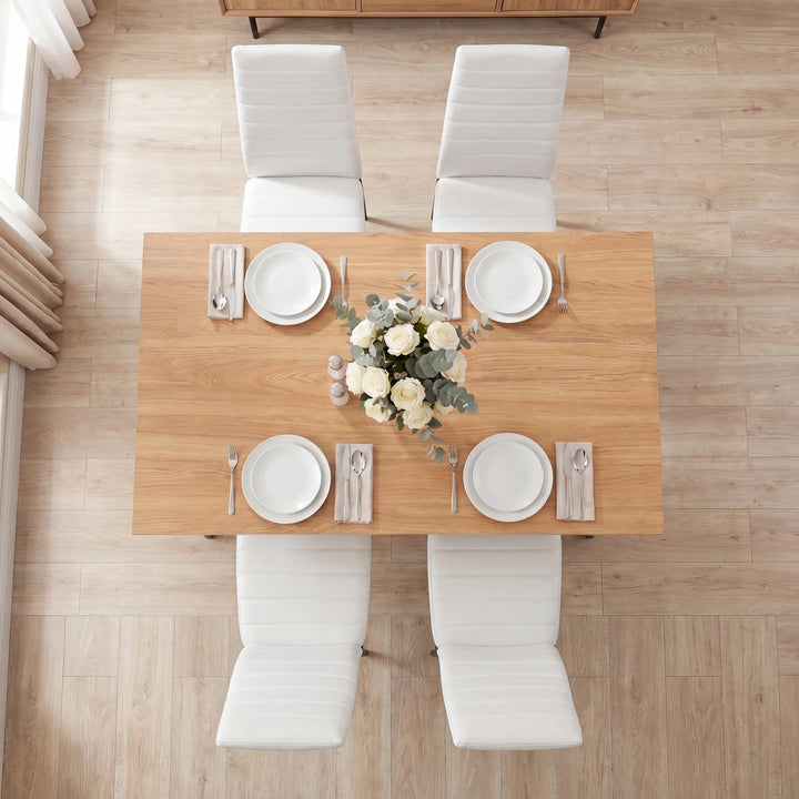 [4 Seater | White] Overhead view of a Grey & Pine dining table with four white chairs and white place settings.