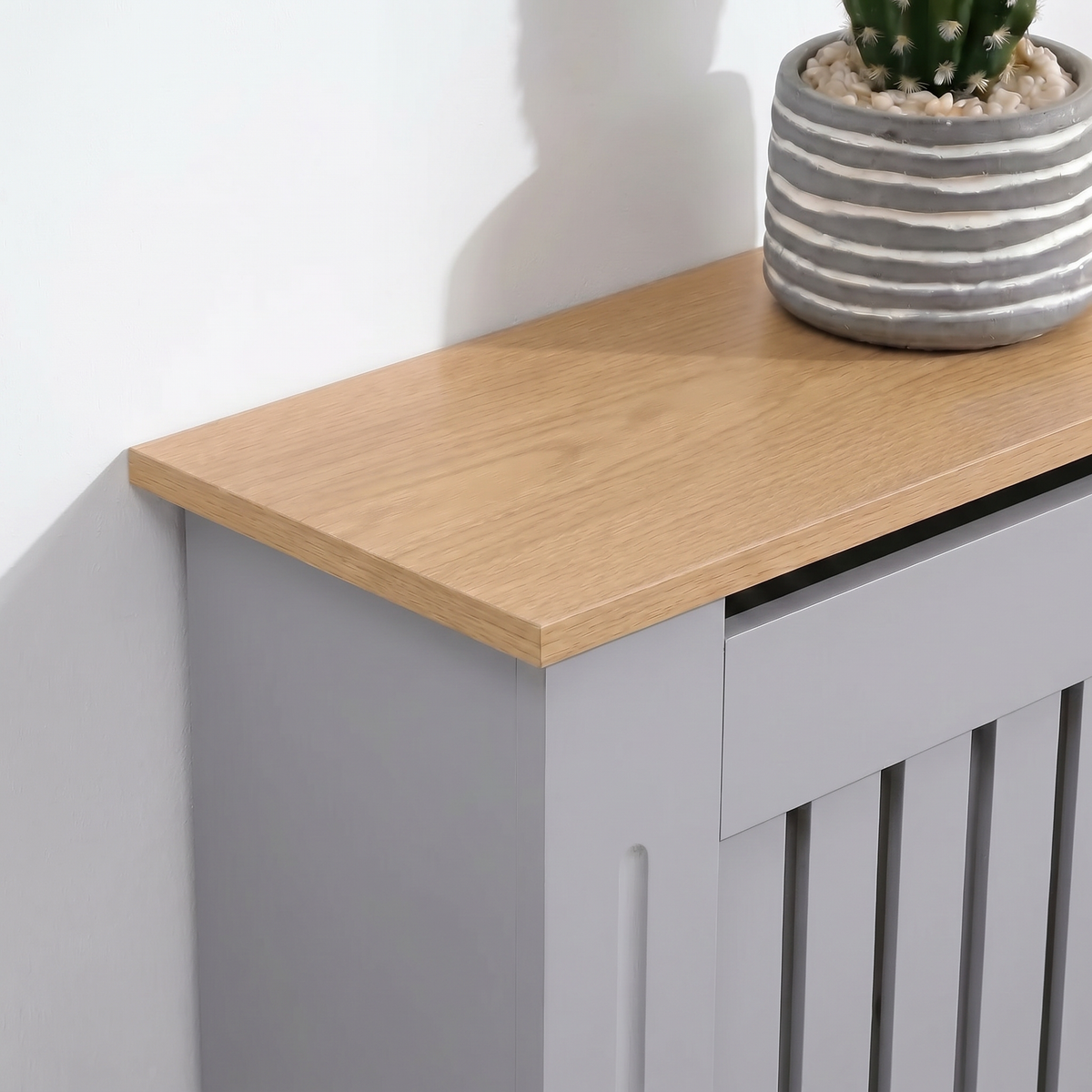[Small | Grey] Radiator Cover corner detail showing the natural oak-effect top panel