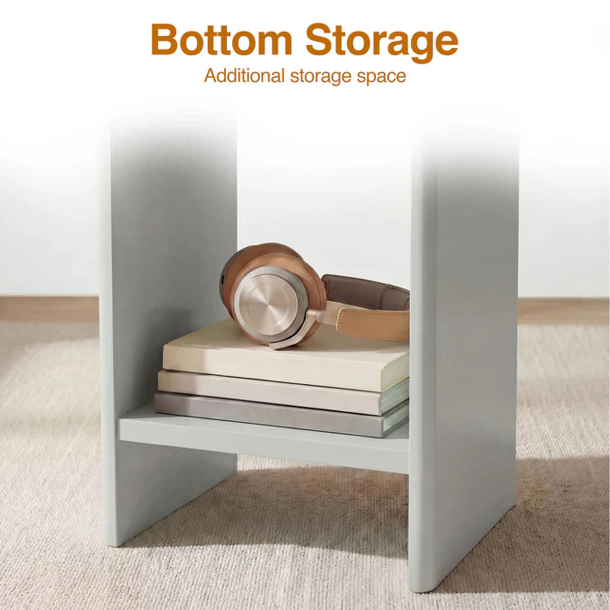 [Grey] Small Round Side Table with Shelf Living Room close-up of lower storage shelf between panel legs holding stacked books and headphones on beige rug
