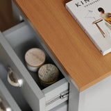 [Grey] close up of oak effect top and open drawer with two ceramic candles inside grey shaker bedside