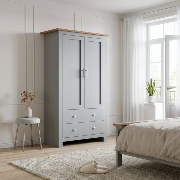 [Grey] Shaker wardrobe in bedroom with closed double doors, lower drawers, oak top, window, bed, and stool.