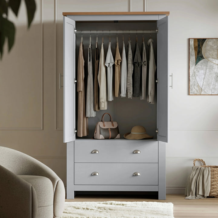 [Grey] Shaker wardrobe with doors open, showing hanging rail, clothing, handbag, hat, drawers, and wall art.