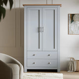 [Grey] Front-on grey Shaker double wardrobe with cup-handle drawers, neutral wall, armchair and rug