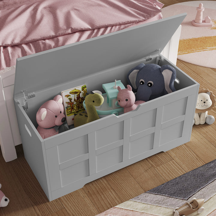 [Grey] Open grey shaker storage chest filled with children's soft toys, white teddy on the floor to the right