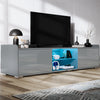 [Grey] Living room shot: grey TV unit on wood floor, lamp and decor on top, TV mounted above