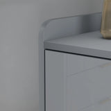 [Grey] Top-edge detail shot of grey high gloss TV unit, decor right, neutral backdrop