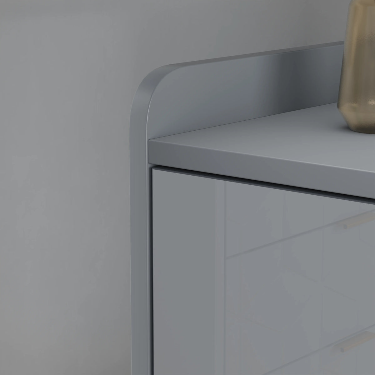 [Grey] Top-edge detail shot of grey high gloss TV unit, decor right, neutral backdrop